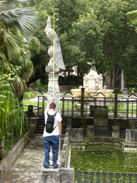A student measuring one of the peacock columns in the Marine Garden.